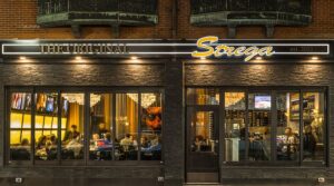 Strega restaurant exterior with warm lighting
