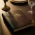Leather bound restaurant menu on a candlelit table